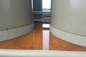 Tanks in oil field with pads from Specified Containment