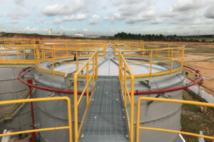 Tanks in oil field with pads from Specified Containment