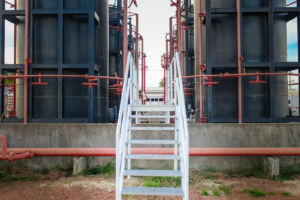 Tanks in oil field with pads from Specified Containment